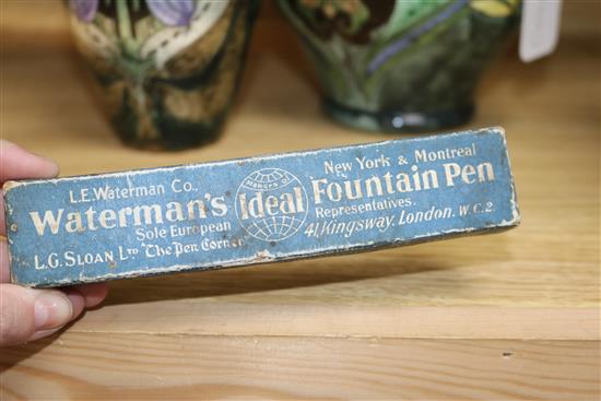 A collection of advertising arts materials, bottles etc